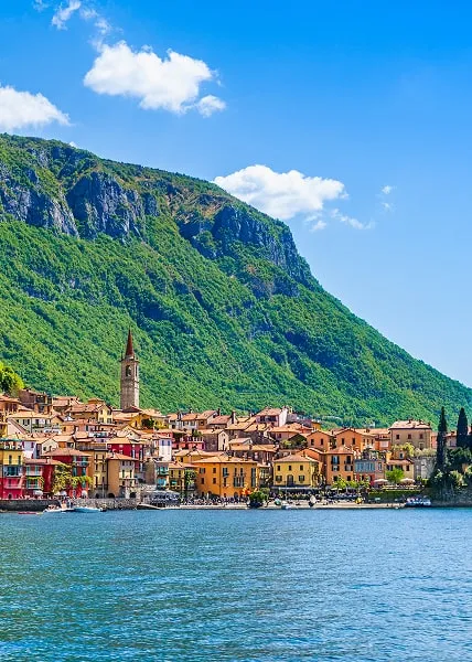 Colorful buildings of Varenna by Lake Como with mountain backdrop